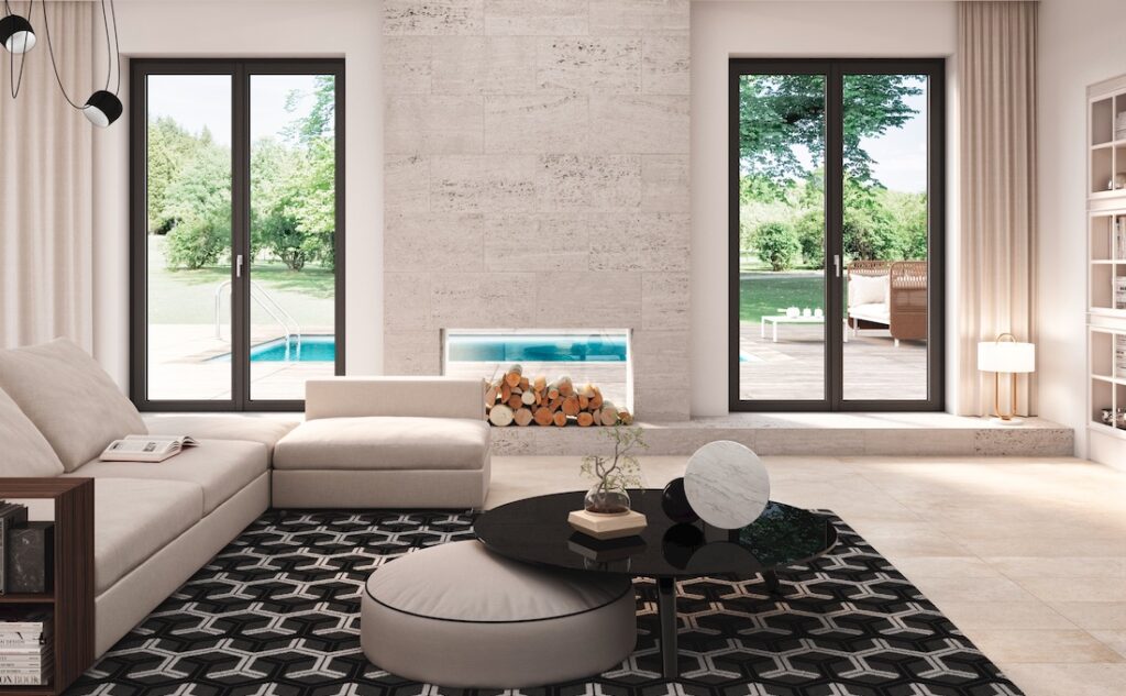 Zona living con porte finestre Prolux Evolution di Oknoplast