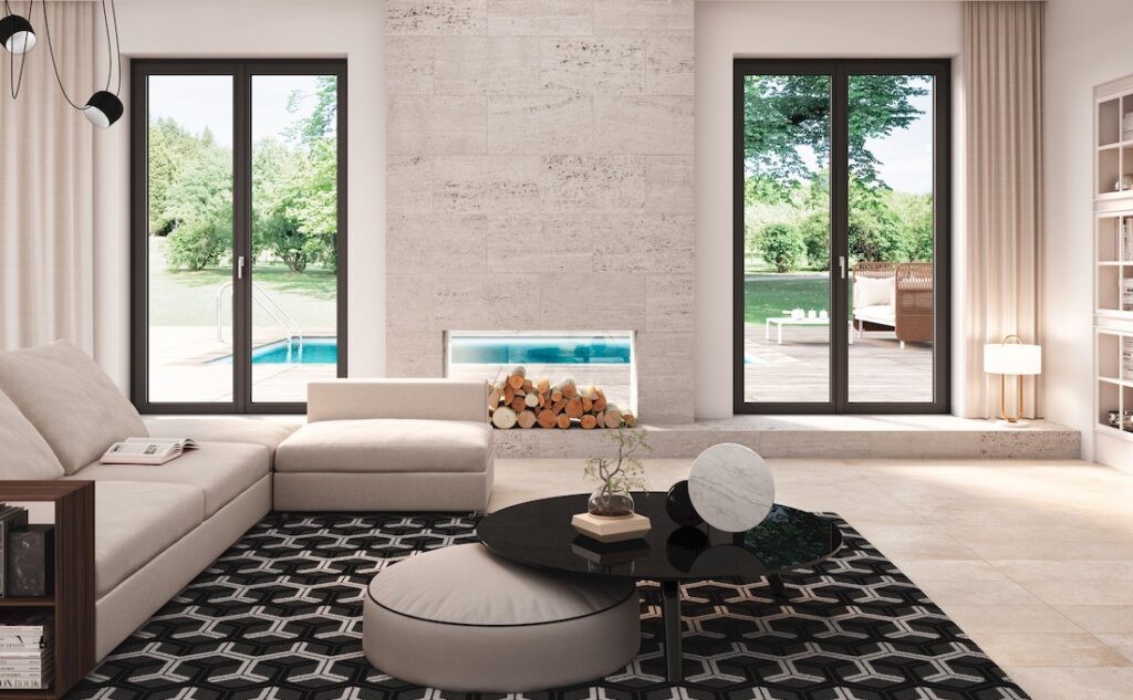 Zona living con porte finestre Prolux Evolution di Oknoplast